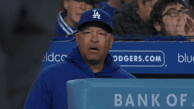 Man In LA Hat In Front Of Bank Of America Sign GIF