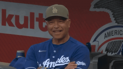 Man In LA Hat In Front Of Bank Of America Sign GIF
