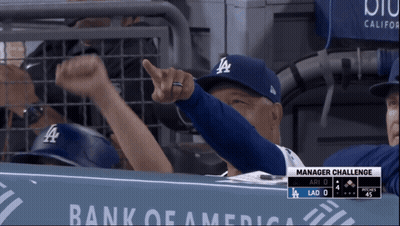 Man In LA Hat Pointing At Camera GIF