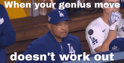 Man In LA Hat Sitting In Dugout GIF