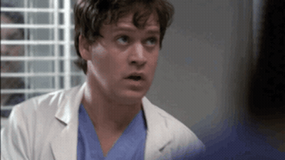 Man In Lab Coat And Scrubs Looking Up GIF