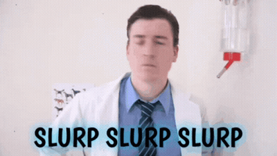 Man In Lab Coat And Tie Slurp Slurp Slurp GIF