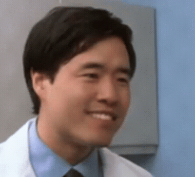 Man in Lab Coat and Tie Smiling