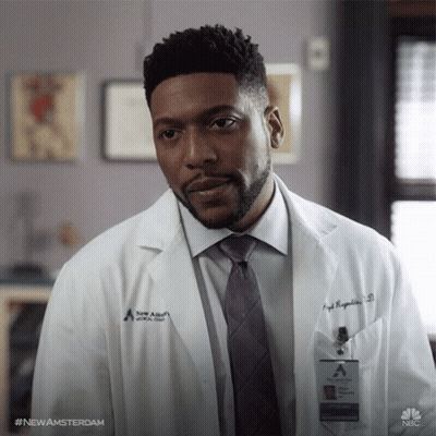 Man In Lab Coat And Tie With Newamsterdam Name Tag GIF