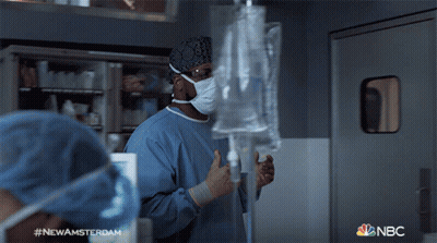 Man In Lab Coat And Tie With Newamsterdam Name Tag GIF