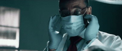 Man In Lab Coat And Tie With Surgical Mask And Gloves GIF