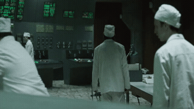 Man In Lab Coat At Control Panel Saying Static Display GIF
