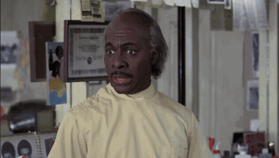 Man In Lab Coat By Framed Certificate GIF
