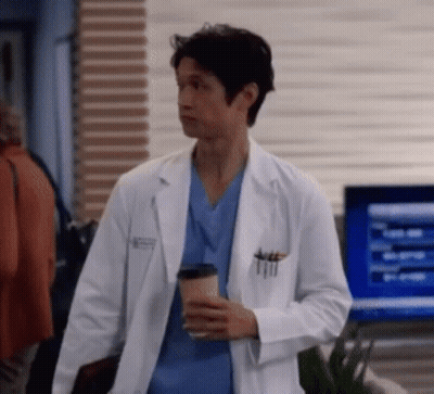 Man In Lab Coat Holding Coffee Cup GIF