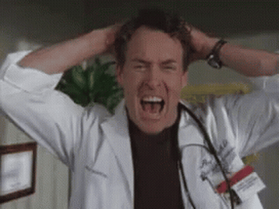 Man In Lab Coat Screaming With Hands On Head GIF