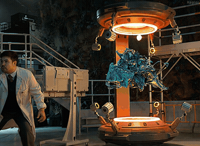 Man In Lab Coat Standing In Front Of Kepler Machine GIF