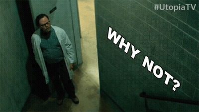 Man In Lab Coat Standing Next To Why Not Sign GIF