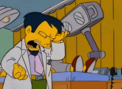 Man In Lab Coat Talking On Cell Phone GIF