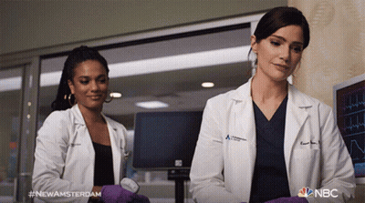 Man In Lab Coat Talking To Man In Scrubs #NewAmsterdam GIF
