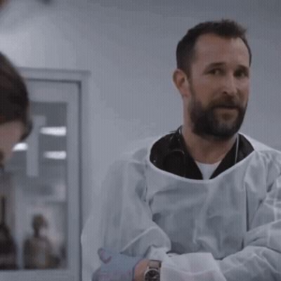 Man In Lab Coat Talking To Man With Watch GIF