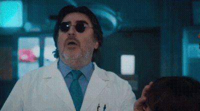 Man In Lab Coat Talking To Patient GIF