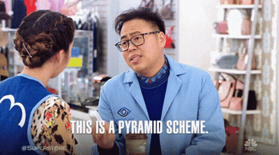 Man In Lab Coat Talking To Woman About Pyramid Scheme GIF
