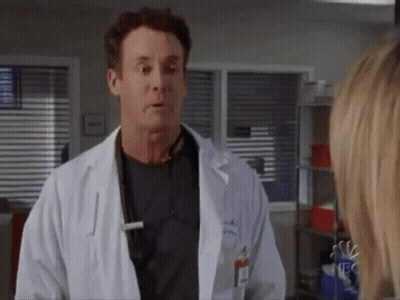 Man In Lab Coat Talking To Woman GIF