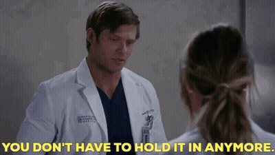 Man In Lab Coat Telling Woman You Don't Have To Hold It In Anymore GIF