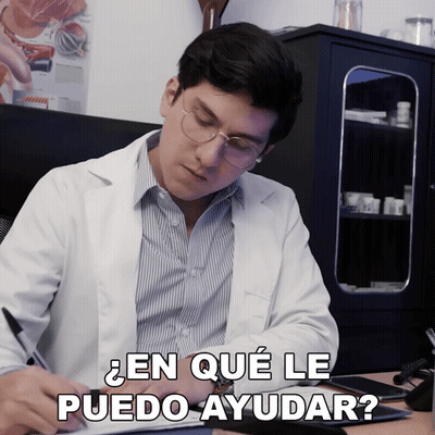 Man In Lab Coat Writing En Que Le Puedo Ayudar GIF