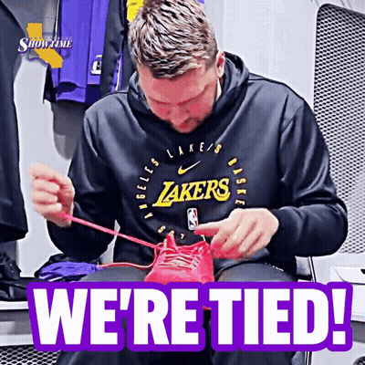 Man In Lakers Hoodie Tying Shoes GIF