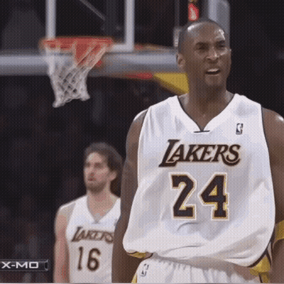 Man in Lakers Jersey in Front of Basket