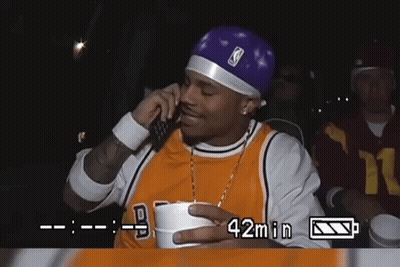 Man In Lakers Jersey Talking On Phone GIF