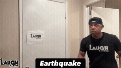Man In Laugh Nation Shirt At Door GIF