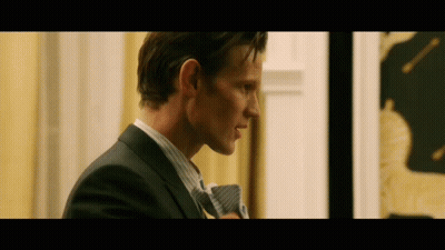 Man In Laurel Wreath Stands Before Crowd GIF