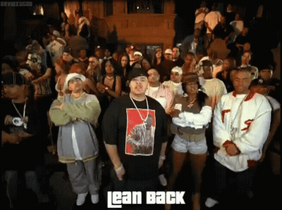 Man In Lean Back Shirt Standing Before Crowd GIF