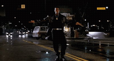 Man In Leather Coat Dancing On Wet Street GIF