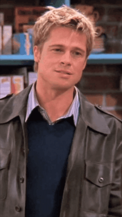 Man In Leather Jacket And Blue Sweater Smiling GIF