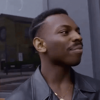 Man In Leather Jacket And Gold Necklace Looking Left GIF