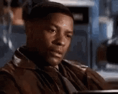 Man In Leather Jacket And Tie Sitting In Chair GIF