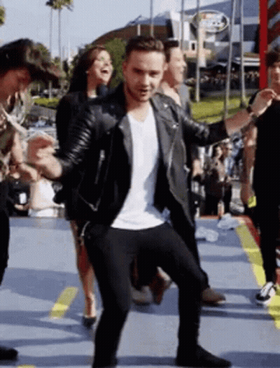 Man In Leather Jacket Dancing With People GIF