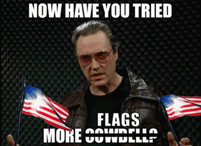 Man In Leather Jacket Holding American Flags Now Have You Tried Flags More Cowbell GIF