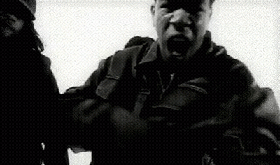 Man In Leather Jacket Holding Gun GIF