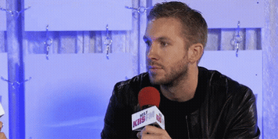Man In Leather Jacket Holding Hot 107.9 Microphone GIF