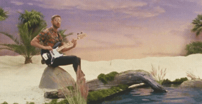 Man In Leather Jacket Holding Hot 107.9 Microphone GIF