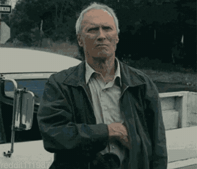Man In Leather Jacket In Front Of Bus GIF