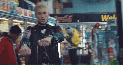 Man In Leather Jacket In Front Of Coca Cola Cooler GIF