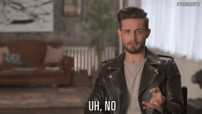 Man In Leather Jacket Making Funny Face In Chair GIF