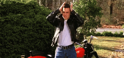 Man In Leather Jacket Next To Red Motorcycle GIF