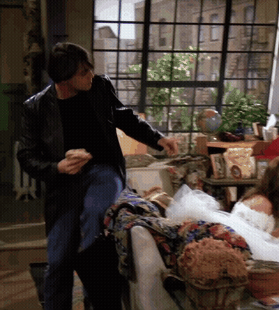 Man In Leather Jacket Next To Woman In White Dress GIF