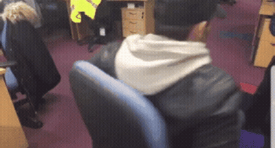 Man In Leather Jacket Sitting In Blue Chair GIF