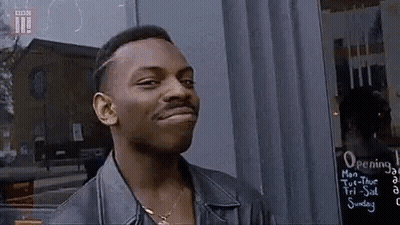 Man In Leather Jacket Smiling At Camera GIF