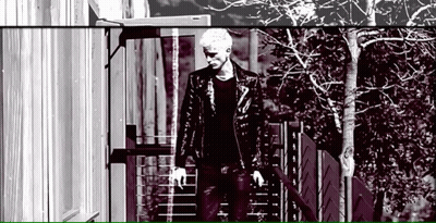 Man In Leather Jacket Walking Down Stairs GIF
