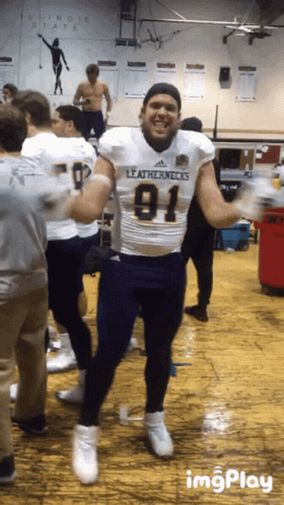 Man In Leathernecks Jersey Dancing In Gym GIF