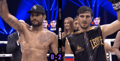 Man In Leone Shirt Next To Boxer In Ring GIF