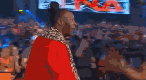 Man In Leopard Print Coat In Front Of Screen GIF